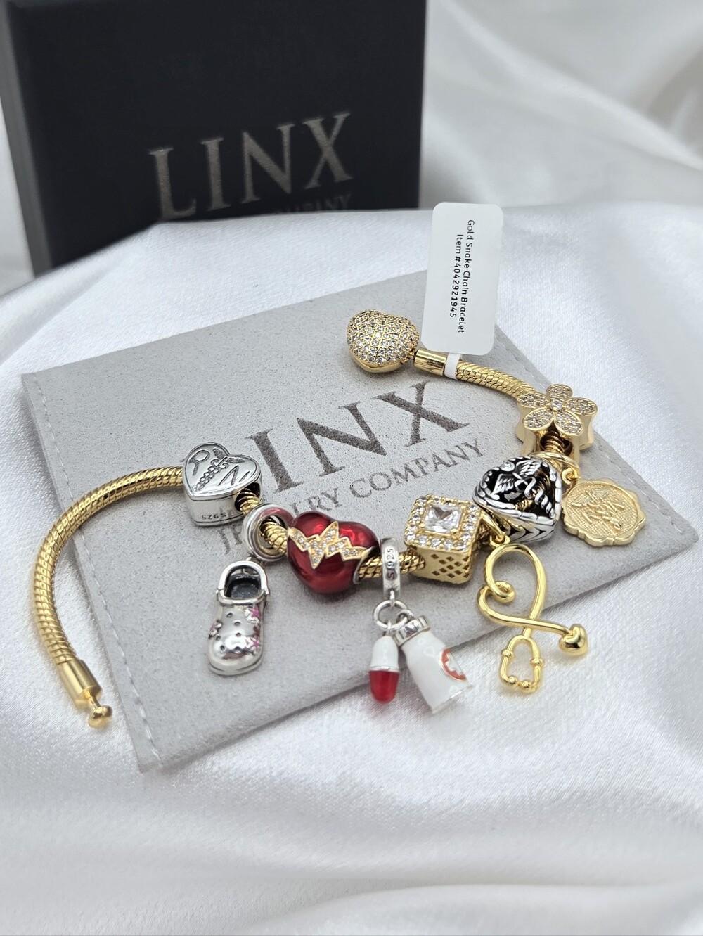 Linx Gold Snake Chain Bracelet With Registered Nurse Themed Charms